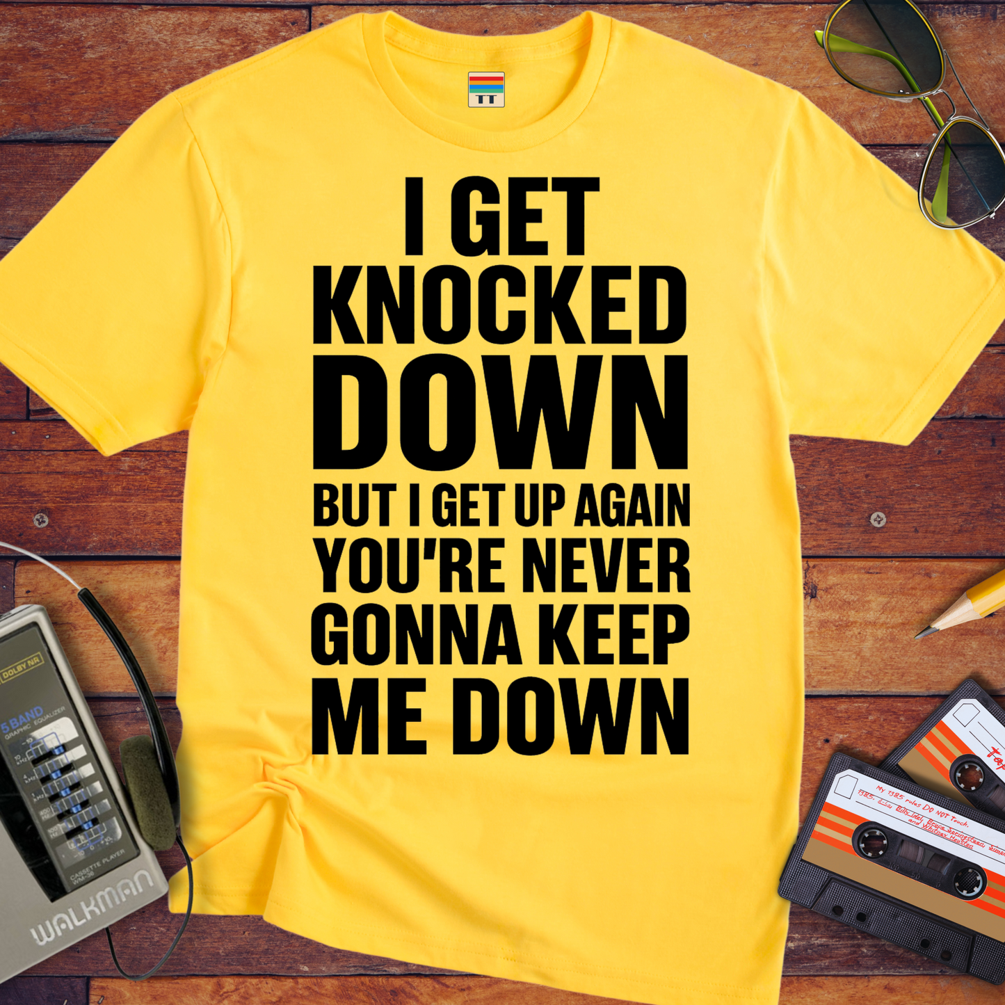 'I GET KNOCKED DOWN BUT I GET UP AGAIN YOU'RE NEVER GONNA KEEP ME DOWN' T-Shirt