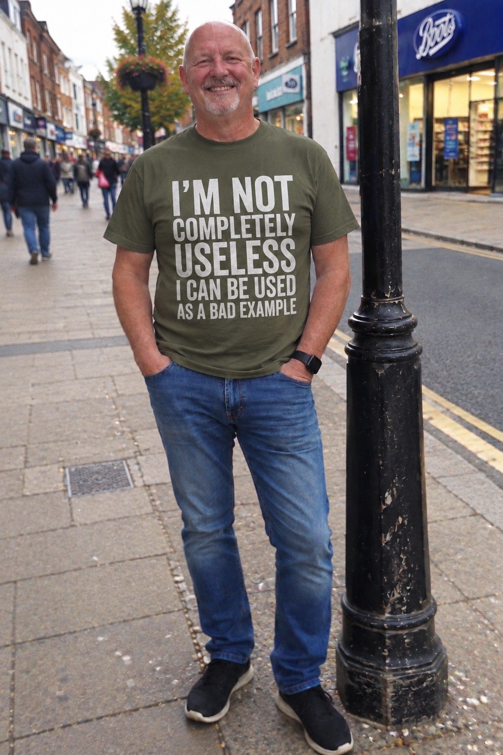 Man wearing military green I'm Not Completely Useless T-shirt on a UK high street