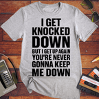 'I GET KNOCKED DOWN BUT I GET UP AGAIN YOU'RE NEVER GONNA KEEP ME DOWN' T-Shirt