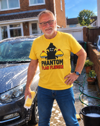 Man washing car wearing yellow Phantom Flan Flinger T-shirt