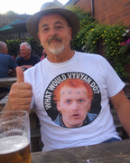 Casual pub garden mock-up of What Would Vyvyan Do T-shirt